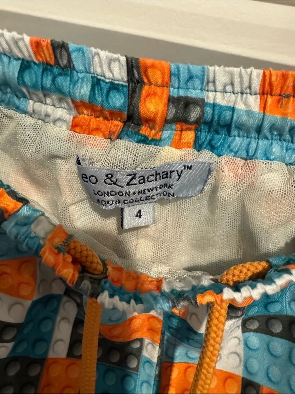 Kids Blue & Orange Swim Trunks with Block Print